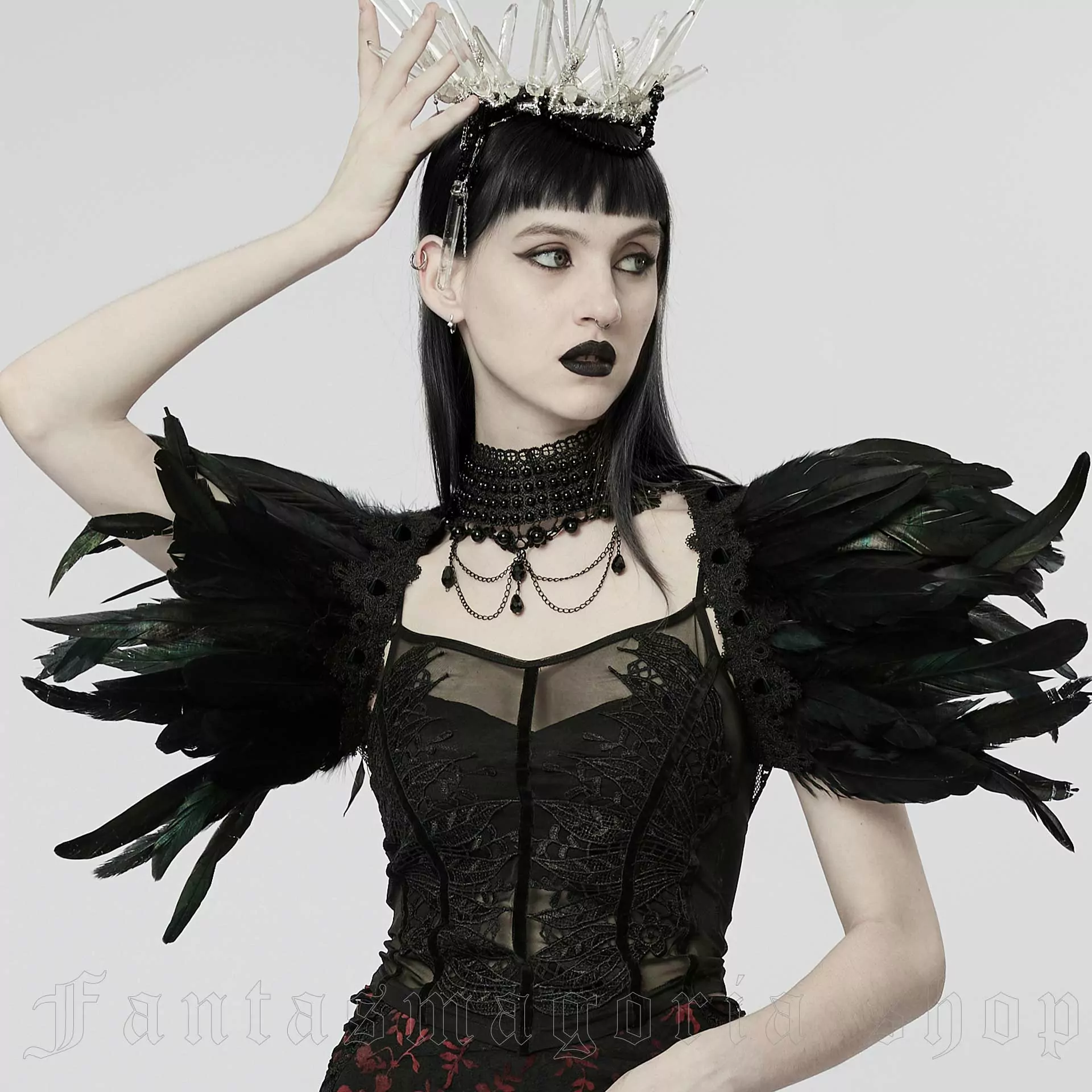Gothic feather shoulder accessory.