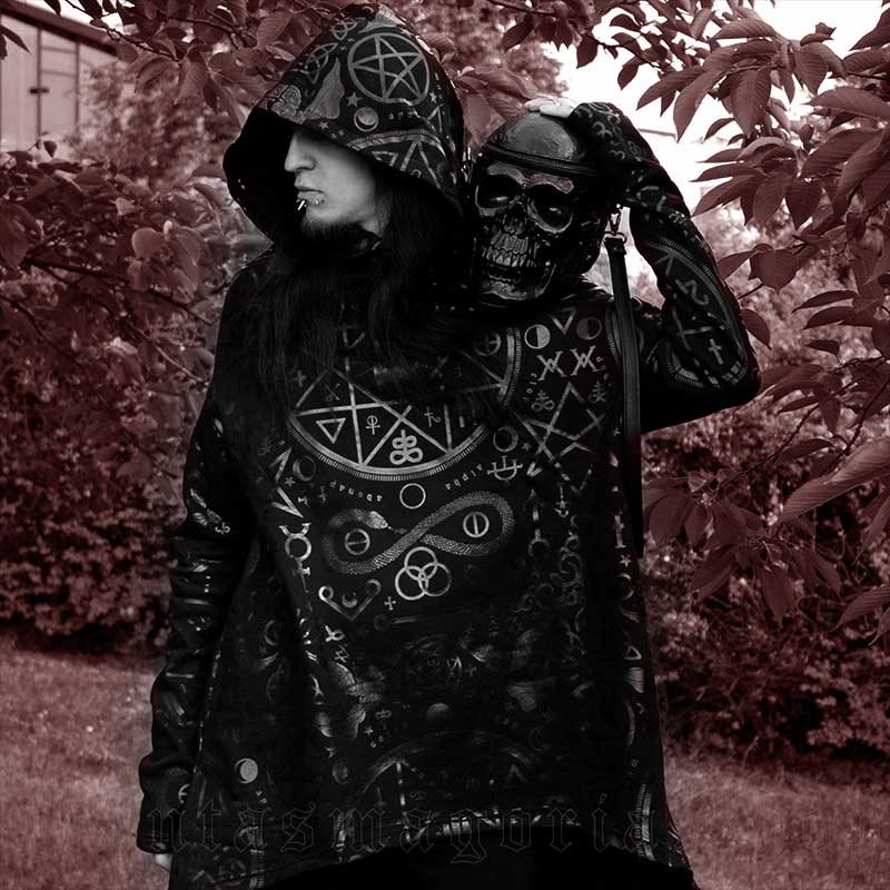 Goth boy in a loose fit hoodie, with skull bag