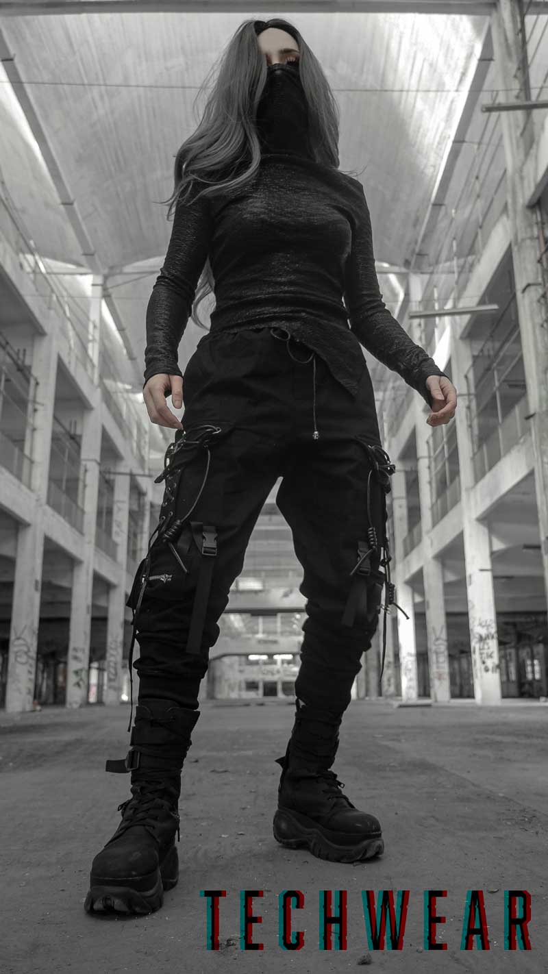 Image of a girl dressed up in Techwear style pants and top from Fantasmagoria store.